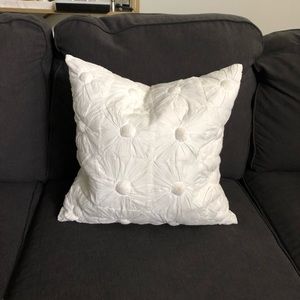 White DKNY throw pillow